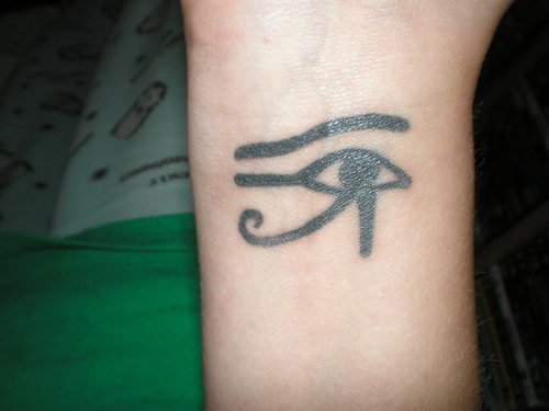 Black Ink Horus Eye Tattoo On Wrist